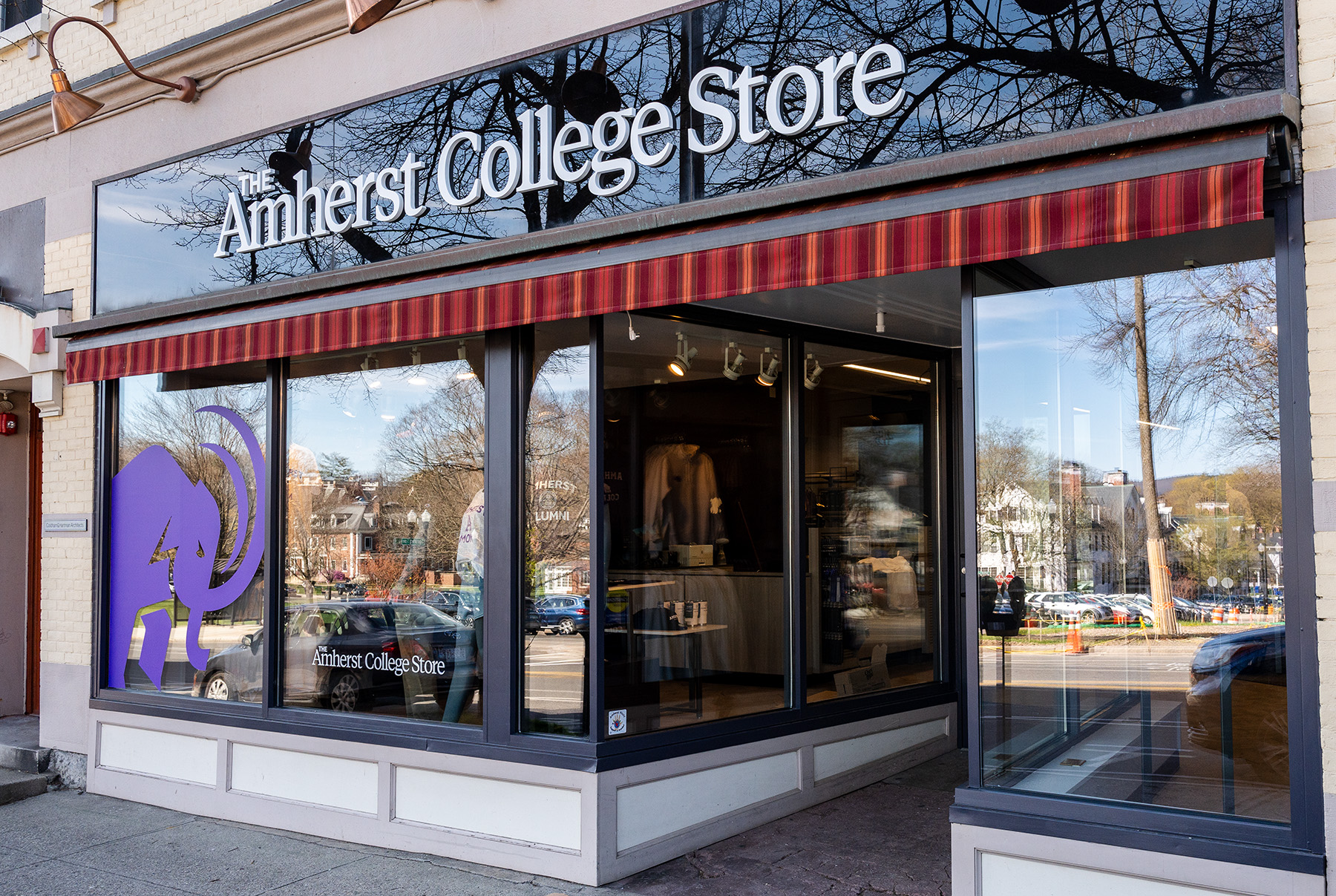 A storefront with a sign that says Amherst College Store.